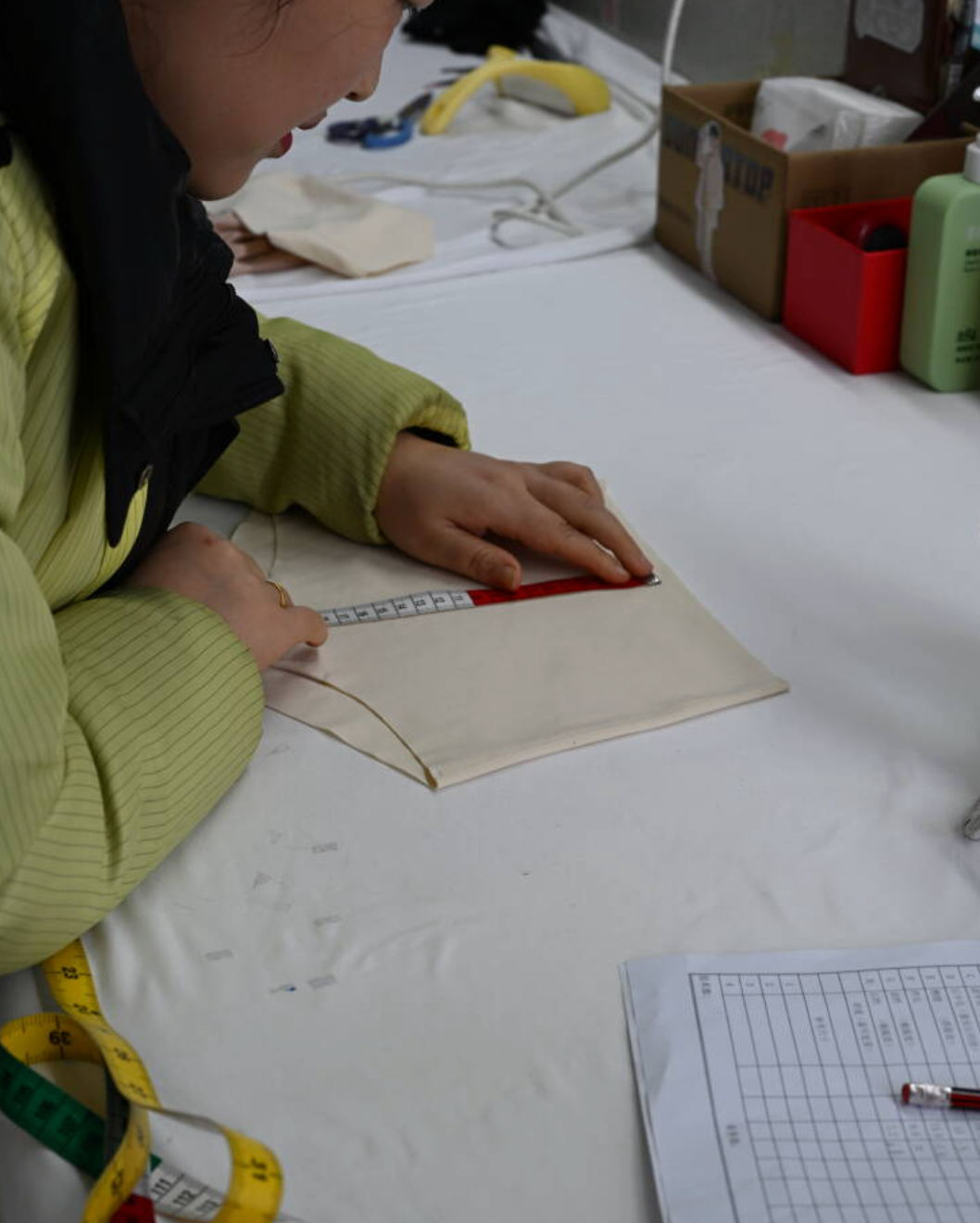 A sample being measured by hand in the workshop.